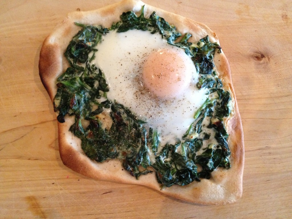Spinach with a soft-cooked egg