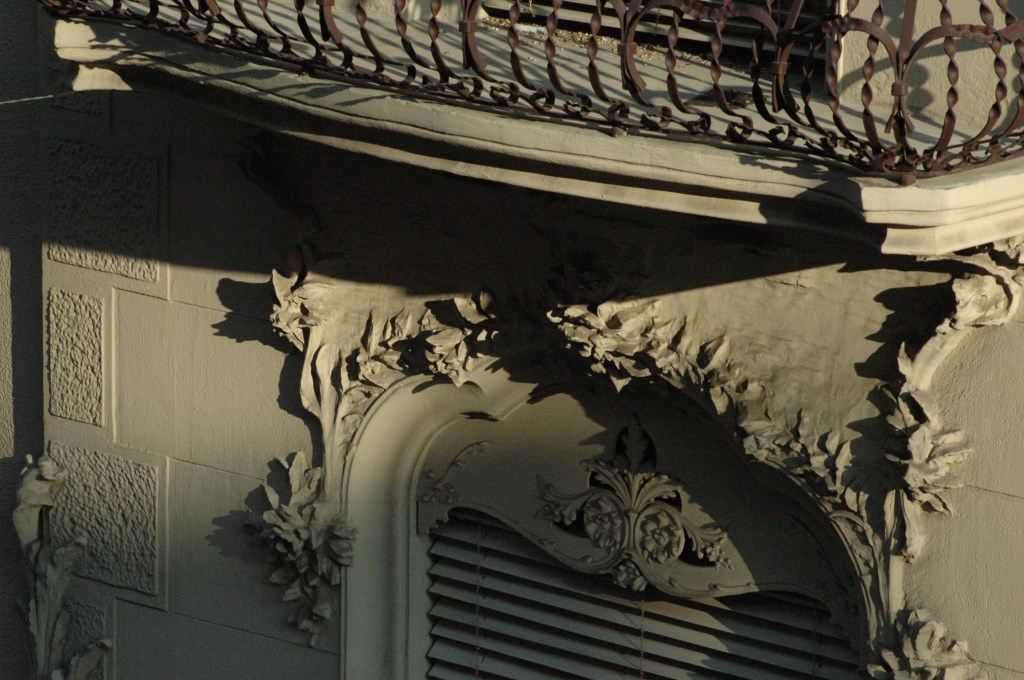 Plant detailing appearing to emerge from the rendering