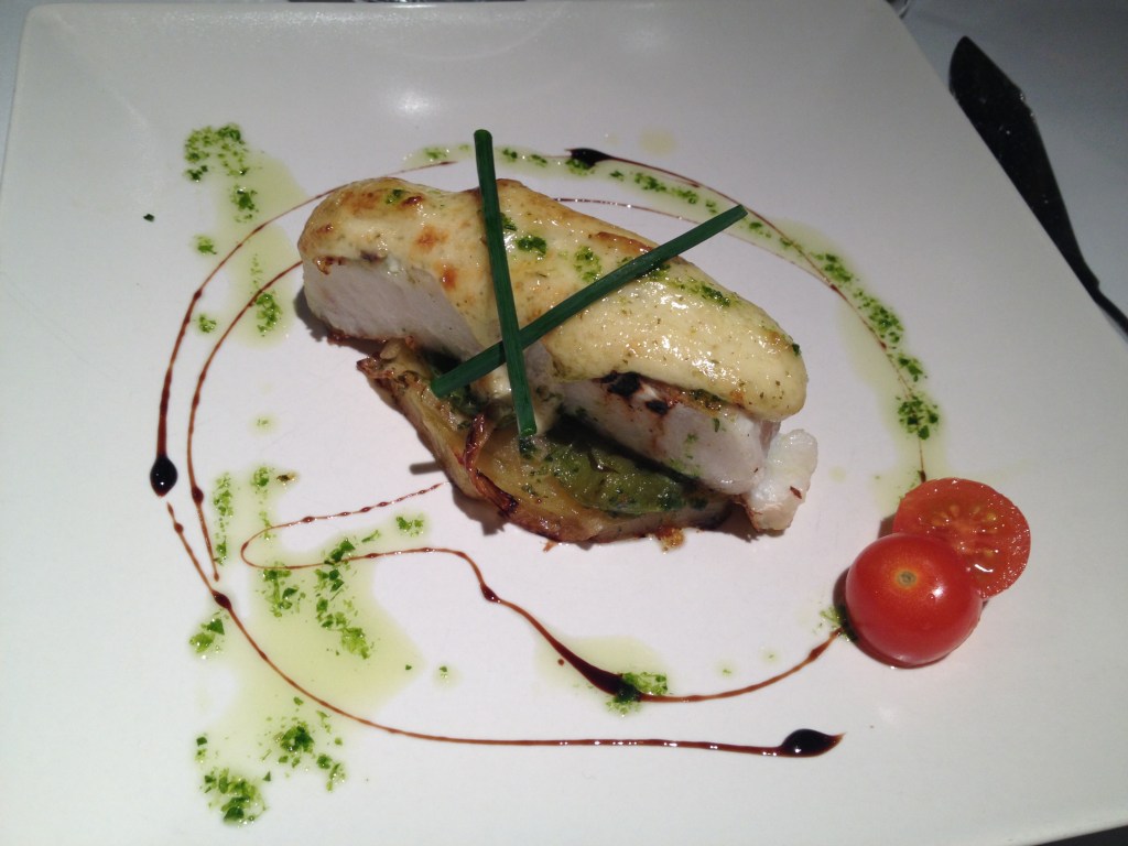 Hake with a garlic and basil sauce